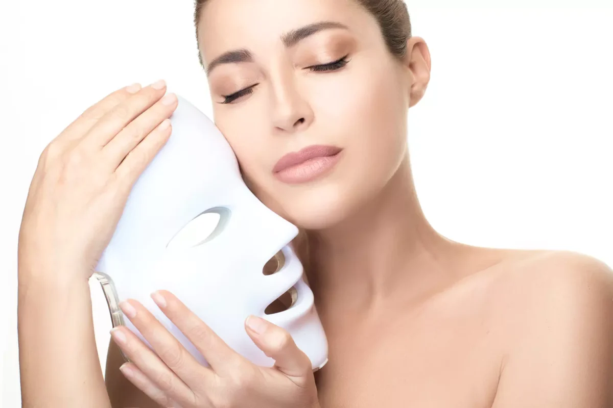 Elegant Woman with Glowing Skin After LED Mask Treatment