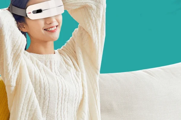 Refreshing Skincare Routine with LED Technology A woman applying a beauty device to her face while wearing a towel and a cooling sheet mask.